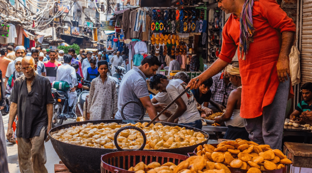 A man cooking food in a street market.