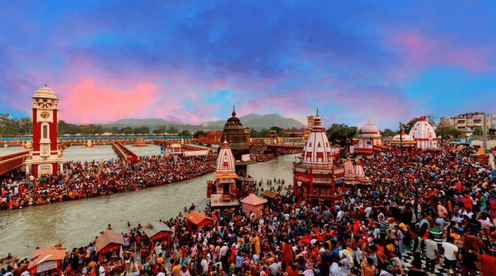 Crowds of people gathered at the Kumbh Mela festival in Haridwar, celebrating spirituality and culture of India.