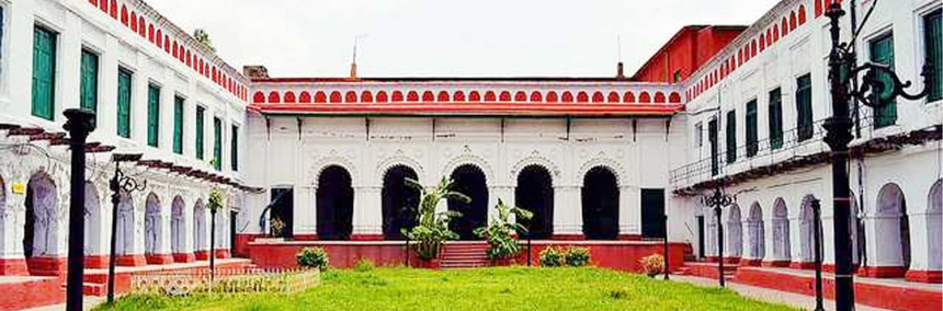a red and white coloured building called Shobhabazar Rajbari
