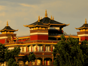 A grand heritage temple looking structure with numerous towers rising prominently.