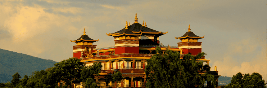 A grand heritage temple looking structure with numerous towers rising prominently.