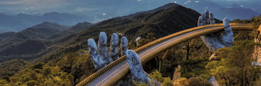 The Golden Bridge in Vietnam, featuring giant stone hands supporting a golden walkway amidst lush green mountains.